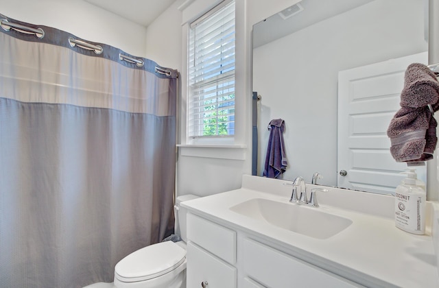 2557 Hatch Dr, Johns Island, SC 29455 - bathroom with toilet, visible vents, curtained shower, and vanity
