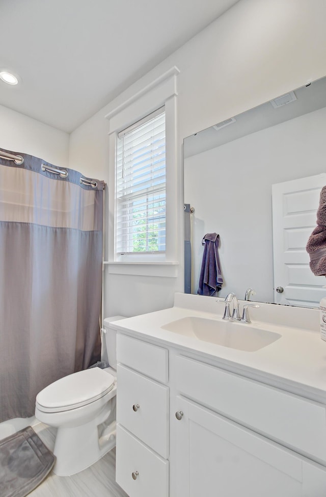 2557 Hatch Dr, Johns Island, SC 29455 - bathroom with vanity, a shower with curtain, toilet, and visible vents