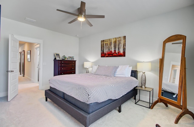 2557 Hatch Dr, Johns Island, SC 29455 - bedroom featuring baseboards, light colored carpet, and ceiling fan