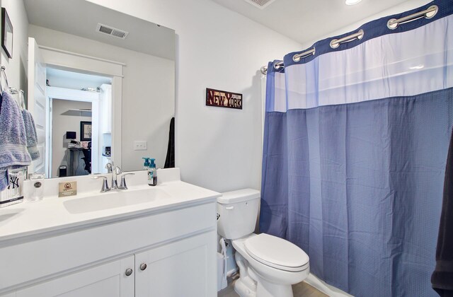 2557 Hatch Dr, Johns Island, SC 29455 - full bathroom featuring toilet, a shower with curtain, visible vents, and vanity