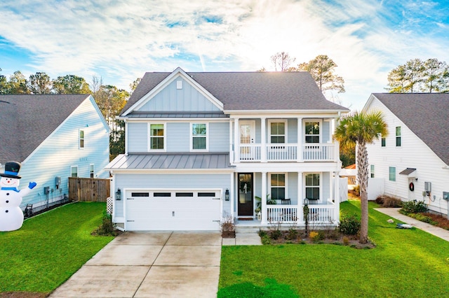 view of front of property with a front yard, a balcony, a garage, and covered porch