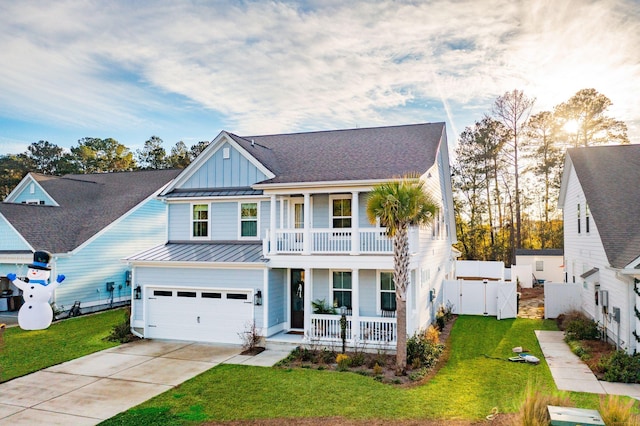 view of front of house featuring covered porch, a garage, a balcony, and a front lawn