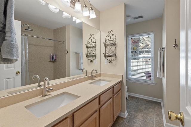 bathroom featuring toilet, vanity, and a shower with shower curtain