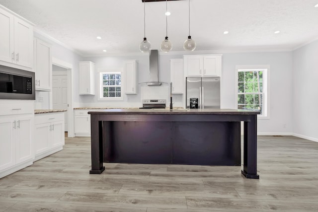 183 Waverly Rd, Walterboro, SC 29488 - kitchen featuring wall chimney range hood, crown molding, appliances with stainless steel finishes, and white cabinets