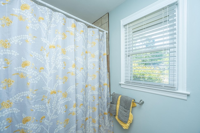 bathroom featuring walk in shower