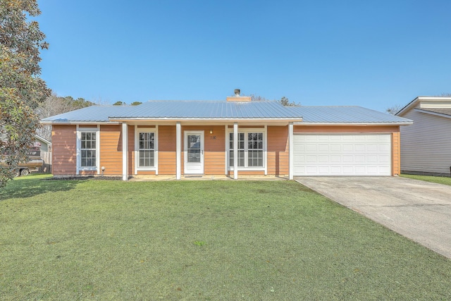 ranch-style house with a garage and a front lawn