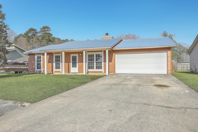 ranch-style home featuring a garage and a front yard