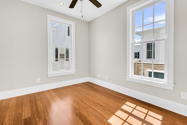 empty room featuring ceiling fan and wood-type flooring