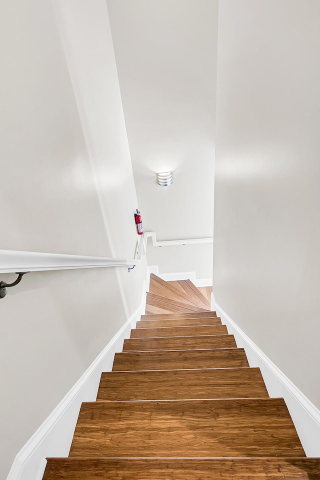 staircase featuring hardwood / wood-style floors