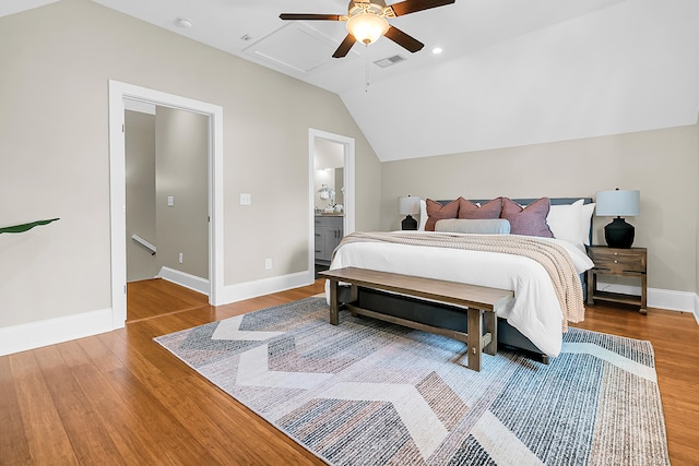 bedroom with ceiling fan, light hardwood / wood-style floors, and vaulted ceiling