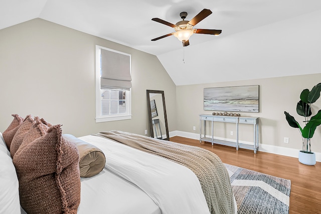 bedroom featuring vaulted ceiling, ceiling fan, and hardwood / wood-style flooring