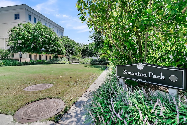 view of home's community featuring a lawn