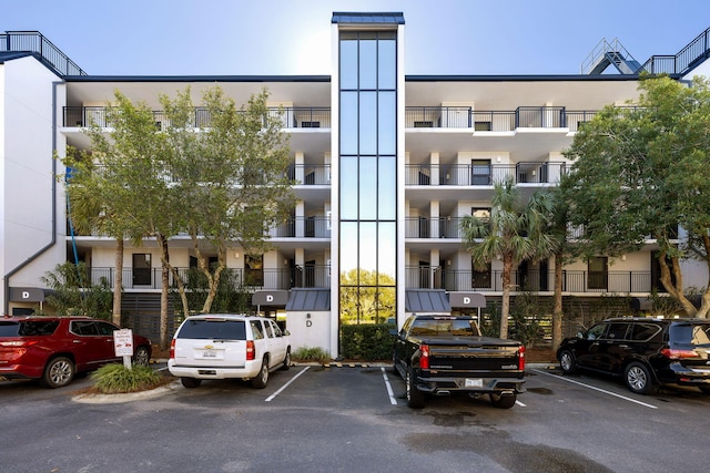 view of property featuring uncovered parking