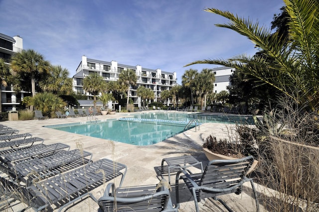 community pool with a patio area