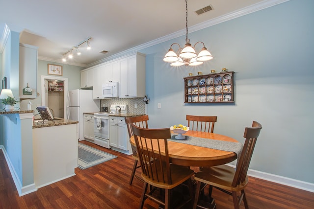 1335 Hopton Cir Unit 1335, Mount Pleasant, SC 29466 - dining space featuring ornamental molding, track lighting, dark wood-style floors, and a chandelier