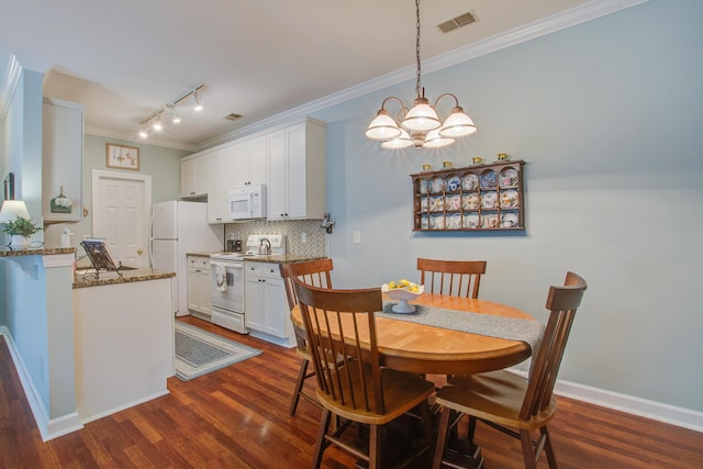 1335 Hopton Cir Unit 1335, Mount Pleasant, SC 29466 - dining space featuring ornamental molding, a chandelier, rail lighting, dark wood-type flooring, and baseboards