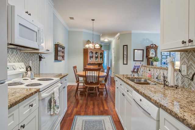 1335 Hopton Cir Unit 1335, Mount Pleasant, SC 29466 - kitchen featuring white appliances, tasteful backsplash, a sink, dark wood finished floors, and ornamental molding