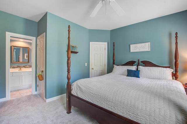 1335 Hopton Cir Unit 1335, Mount Pleasant, SC 29466 - bedroom featuring light carpet, baseboards, ceiling fan, and connected bathroom