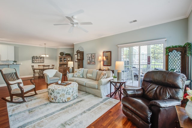 1335 Hopton Cir Unit 1335, Mount Pleasant, SC 29466 - living room with dark wood-type flooring, crown molding, a ceiling fan, and a chandelier