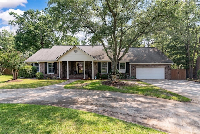 44 S Basilica Ave, Hanahan, SC 29410 - ranch-style home with concrete driveway, a garage, brick siding, and covered porch