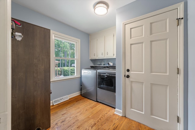 44 S Basilica Ave, Hanahan, SC 29410 - washroom featuring cabinet space, washer and dryer, light wood finished floors, and baseboards