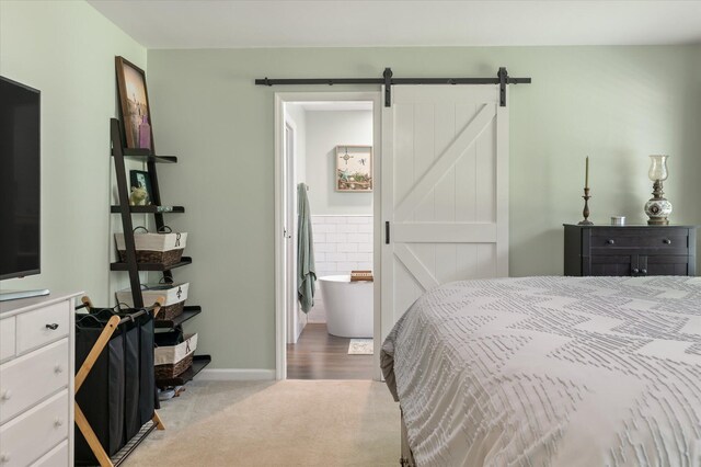 44 S Basilica Ave, Hanahan, SC 29410 - carpeted bedroom with a barn door, baseboards, and connected bathroom