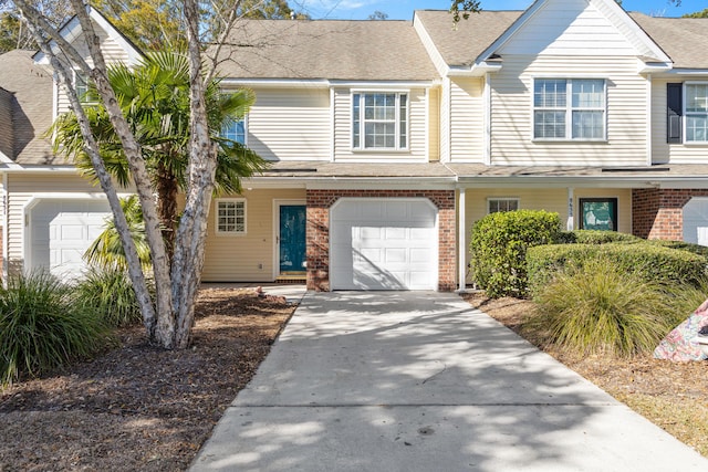 8653 Grassy Oak Trl, North Charleston, SC 29420 - view of property with a garage, brick siding, and concrete driveway