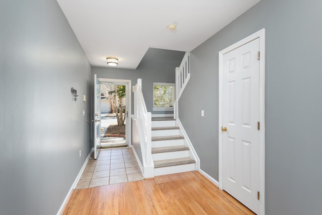 8653 Grassy Oak Trl, North Charleston, SC 29420 - entrance foyer with baseboards, stairway, and light wood finished floors
