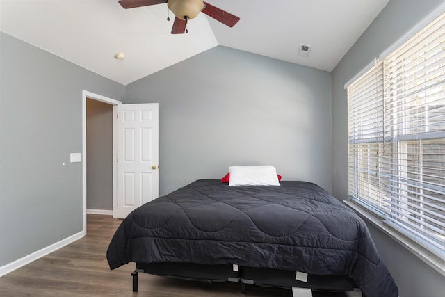 8653 Grassy Oak Trl, North Charleston, SC 29420 - bedroom featuring wood finished floors, a ceiling fan, multiple windows, and lofted ceiling