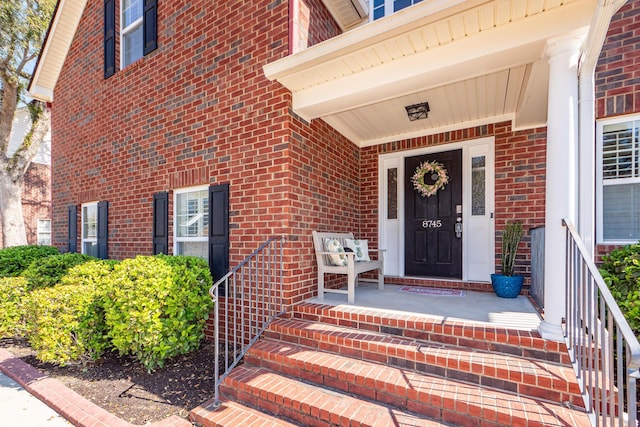 entrance to property with brick siding