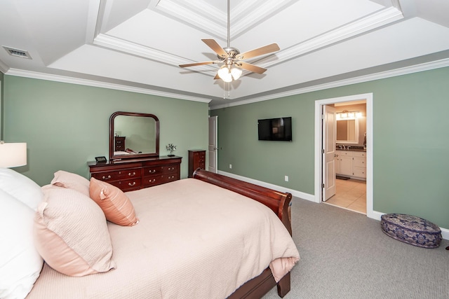 carpeted bedroom with visible vents, baseboards, crown molding, and a tray ceiling