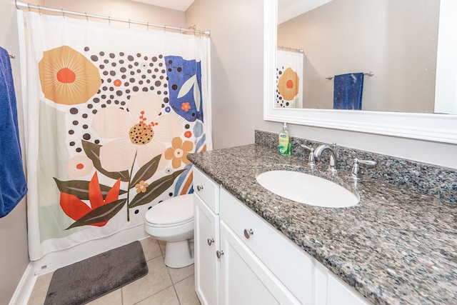 bathroom featuring tile patterned floors, toilet, a shower with shower curtain, and vanity