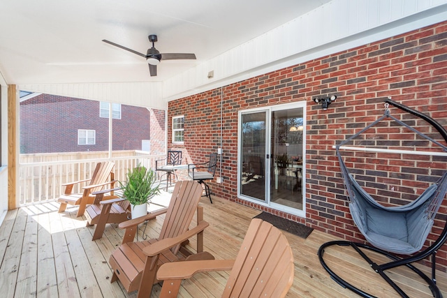 wooden terrace featuring ceiling fan