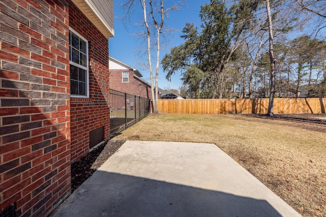 view of yard featuring a patio area and fence