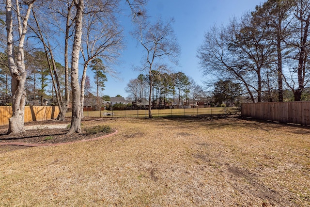 view of yard with fence