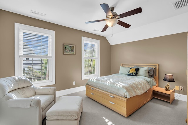 bedroom featuring baseboards, light carpet, ceiling fan, and vaulted ceiling