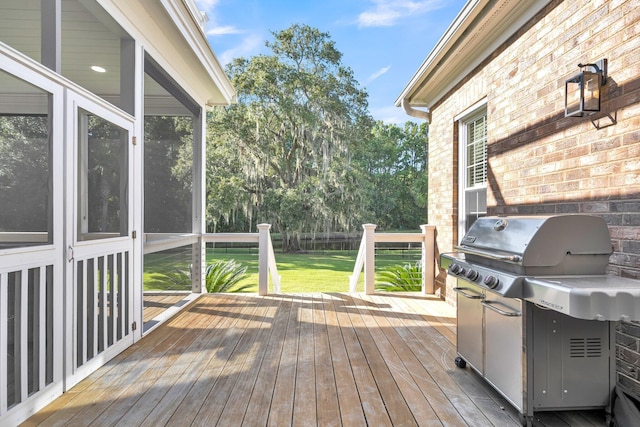 wooden terrace featuring grilling area