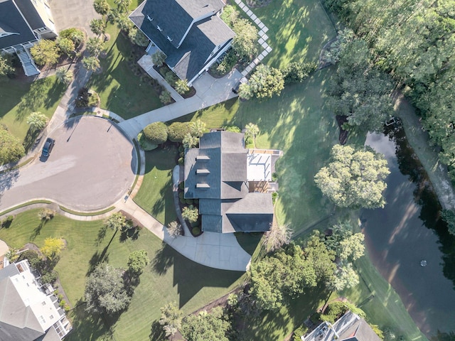 aerial view of property and surrounding area with a large body of water