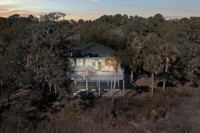 view of back house at dusk