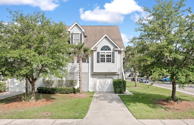 view of front facade with a garage and a front yard