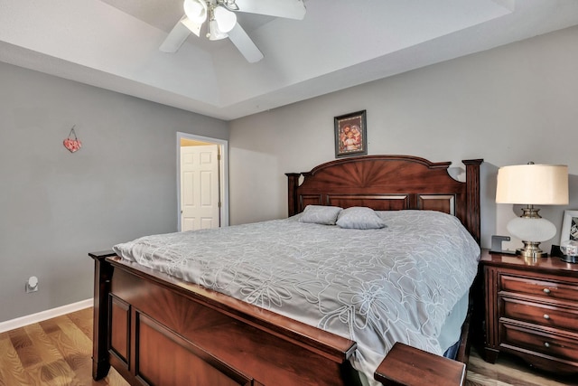 bedroom featuring ceiling fan and hardwood / wood-style flooring