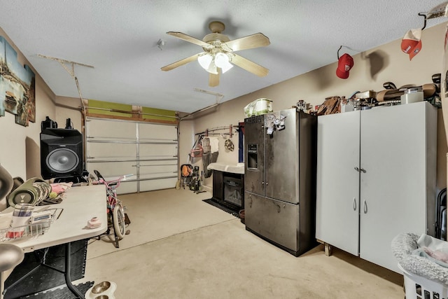 garage with ceiling fan and stainless steel fridge with ice dispenser