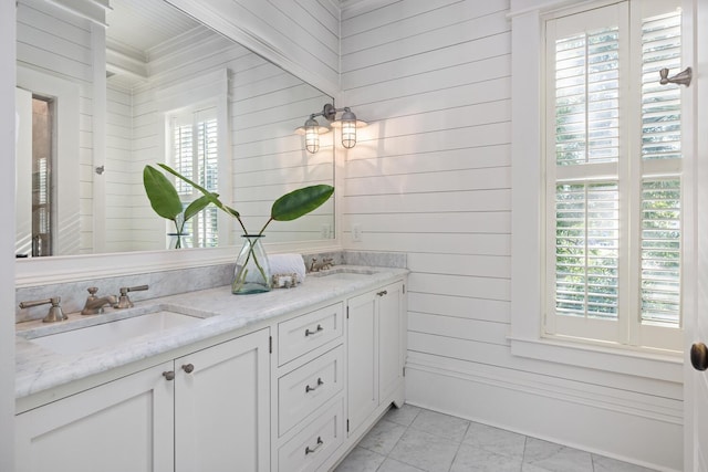 bathroom with wood walls and vanity