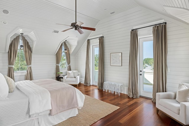 bedroom with dark hardwood / wood-style flooring, access to outside, ceiling fan, wooden walls, and lofted ceiling