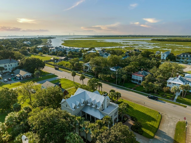 aerial view at dusk with a water view