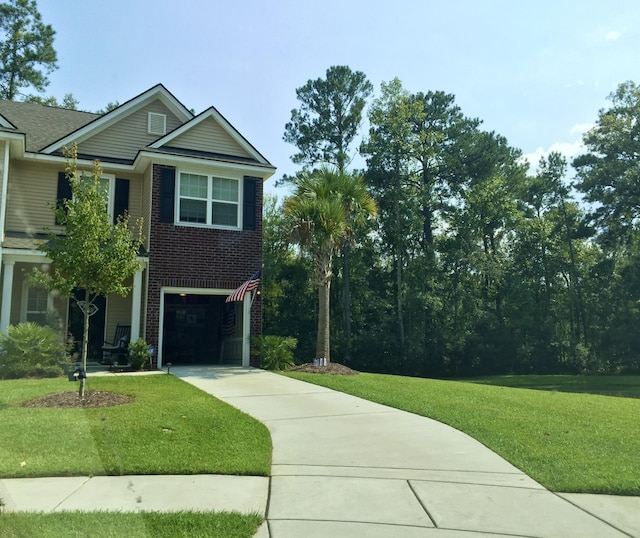 1720 Restoration Ct, Charleston, SC 29414 - view of front of property with driveway, a front lawn, an attached garage, and brick siding