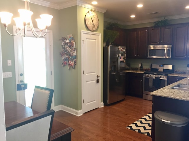 1720 Restoration Ct, Charleston, SC 29414 - kitchen with appliances with stainless steel finishes, recessed lighting, dark wood-type flooring, ornamental molding, and a chandelier