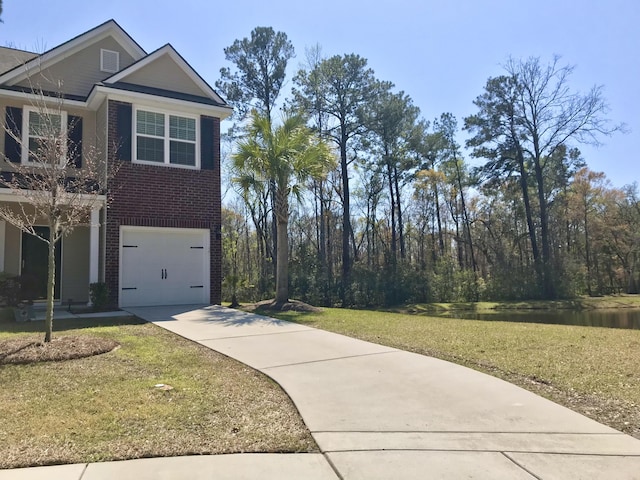 1720 Restoration Ct, Charleston, SC 29414 - view of front facade featuring brick siding, driveway, an attached garage, a front yard, and a water view