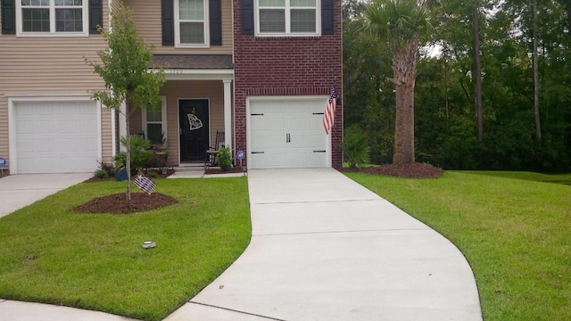 1720 Restoration Ct, Charleston, SC 29414 - view of front of home featuring a front lawn, concrete driveway, brick siding, and a garage