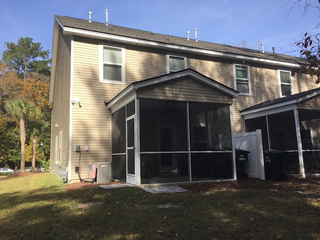 1720 Restoration Ct, Charleston, SC 29414 - rear view of house with a sunroom and a lawn